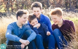 A family photo shoot outdoors with teenagers